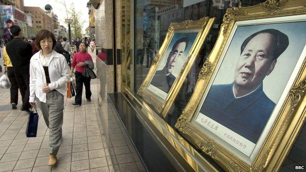 Painting of Chairman Mao hangs in Beijing, China 7 April 2005