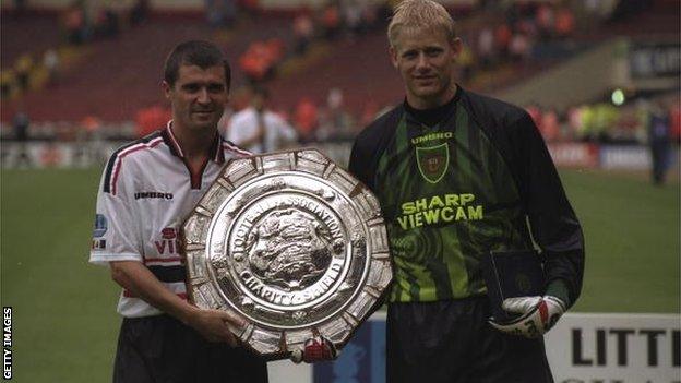 Roy Keane and Peter Schmeichel with the Charity Shield