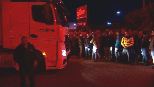 Protestors block a lorry