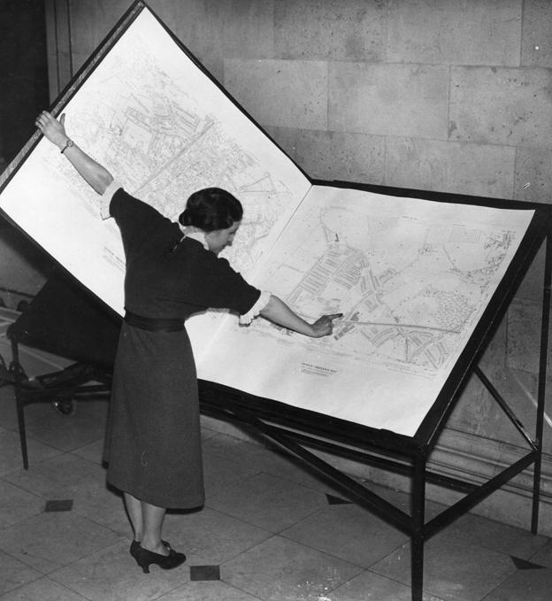 Woman looking at map 1937