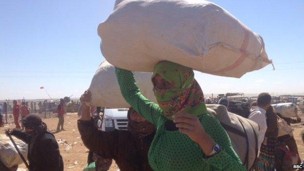 Kurdish woman (unnamed) fleeing Kobane in Syria overland on 22 September 2014