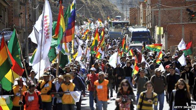 Natives of the Bolivian Amazon lowlands march in protest against the plans to construct a highway through their ancestral territory.