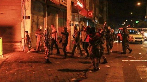 Kurdish protesters are pictured in a street on October 7, 2014 in the southeastern city of Diyarbakir during a demonstration to demand more western intervention against Islamic State militants (IS) in Syria and Iraq