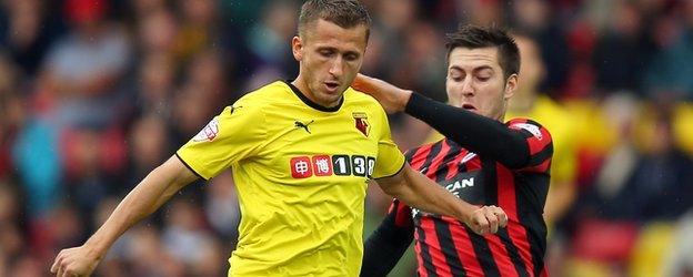 Watford's Almen Abdi is tackled by Gary Gardner of Brighton