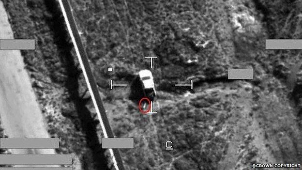 Screen shot of a strike on an IS armed pick-up truck, using a Brimstone missile. The Brimstone missile can be seen here circled in red before impact