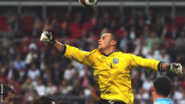 San Marino keeper Aldo Simoncini comes out to try to punch away across against Germany