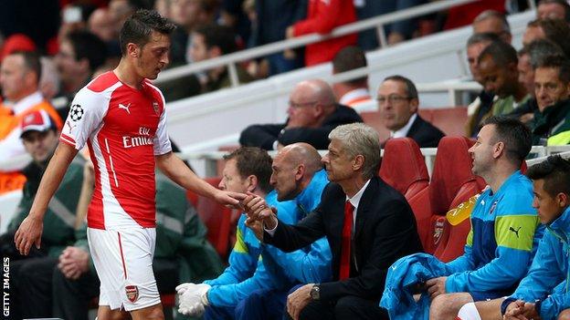 Mesut Ozil and Arsenal manager Arsene Wenger