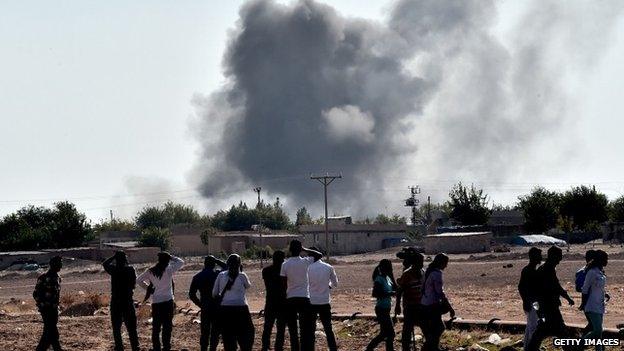 Smoke rising from a building during the fighting in Kobane