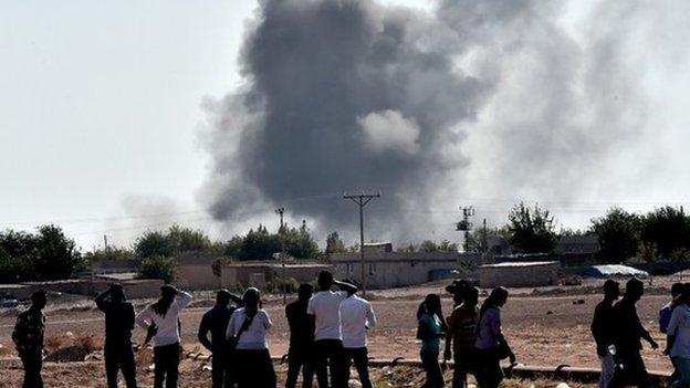 Smoke rising from a building during the fighting in Kobane