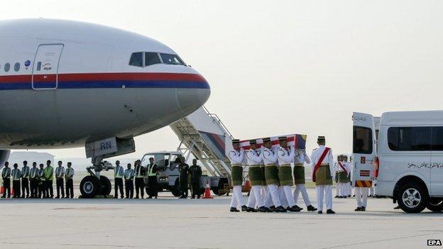 The remains of three Malaysian victims arrive in Kuala Lumpur (19 Sept)