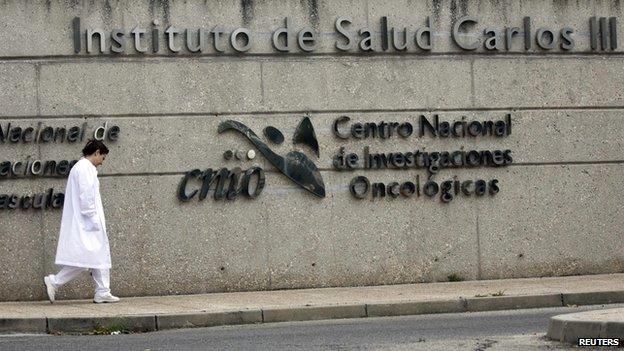 A doctor walks outside Carlos III hospital in Madrid, where a Spanish nurse who contracted Ebola is being treated, October 7, 2014