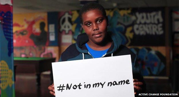 boy holding placard