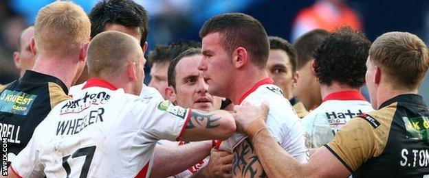 St Helens and Wigan players scuffle at Magic Weekend 2012