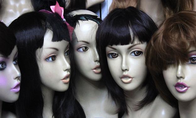 Mannequins wearing wigs and hair extensions