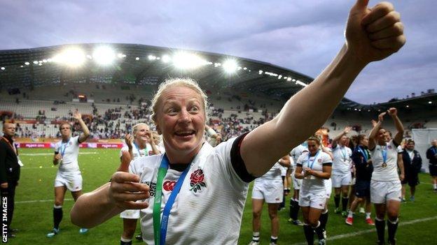 Sophie Hemming waves to the Paris crowd after England's World Cup win