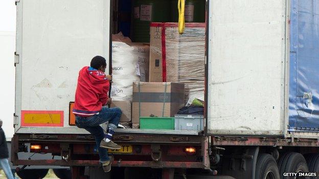 Migrant jumps on to a lorry