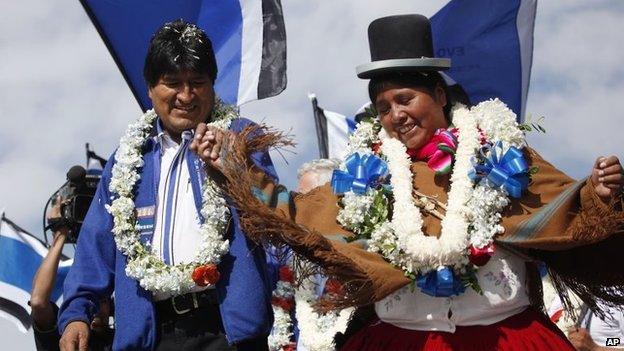 Evo Morales dances with a woman during the closing campaign rally in El Alto on 8 October, 2014