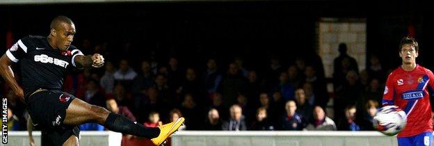 Jay Simpson scores against Dagenham in the Johnstone's Paint Trophy