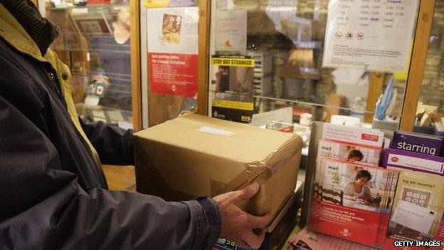 man posting parcel