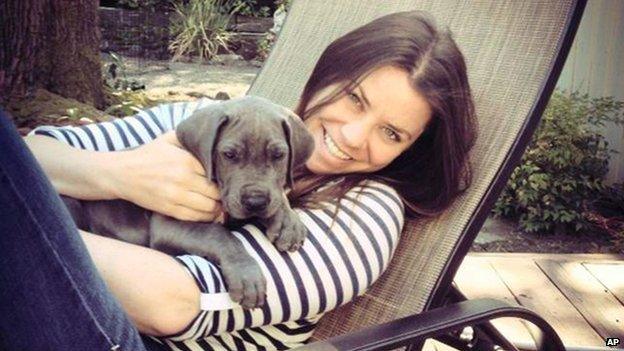 Brittany Maynard poses with a dog.