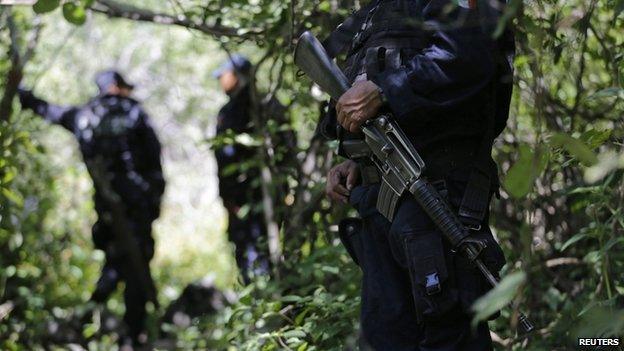 Police guard clandestine graves found in Iguala Guerrero state 9 October 2014