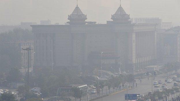 Buildings and roads enveloped by heavy smog on October 10, 2014 in Shenyang, Liaoning province of China.