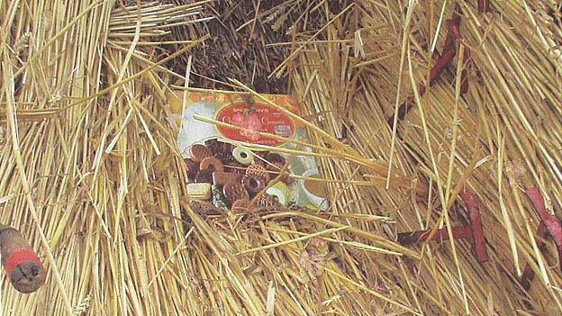 'Time tin' in thatched roof