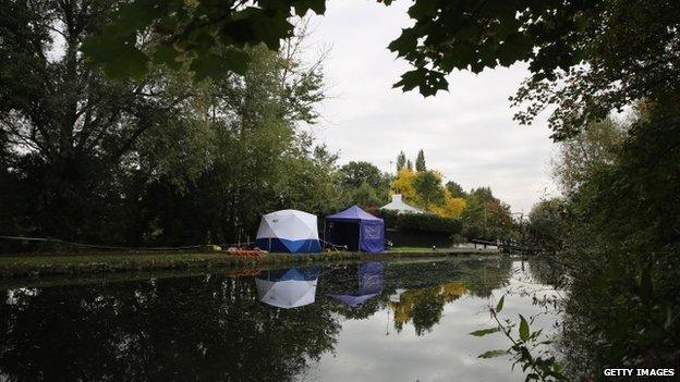 Forensic tents stand beside the Grand Union Canal on 1 October