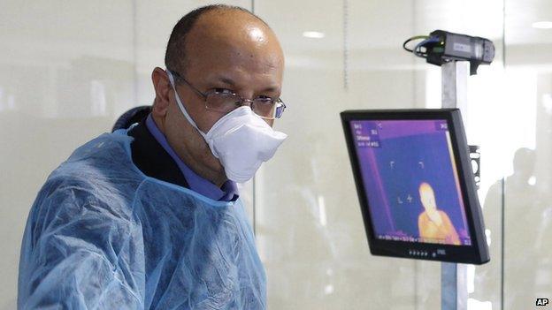 Health worker in Morocco screening air passengers