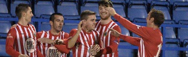 Ruairi Devlin celebrates after scoring the opener at Mourneview Park