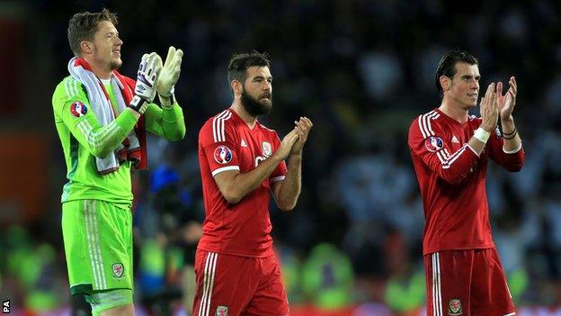 Wales players Wayne Hennessey, Joe Ledley and Gareth Bale applaud the fans