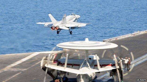 An F/A-18C Hornet leaves the flight deck of the aircraft carrier USS George HW Bush in The Gulf, 10 October