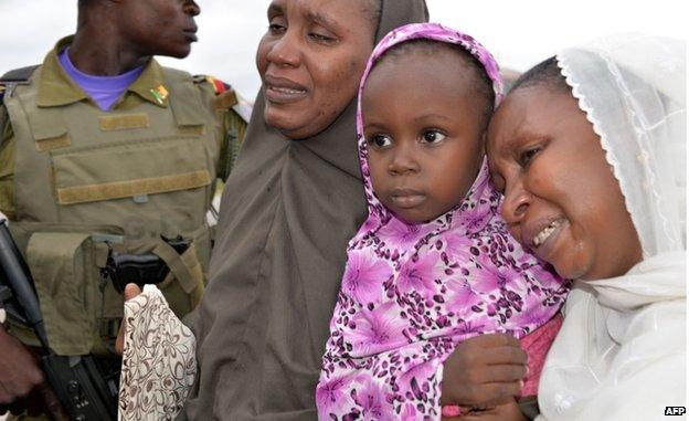 Cameroonian hostages, who were released after being kidnapped in raids blamed on the Nigerian Islamist group Boko Haram, arrive in Yaounde on 11 October 2014