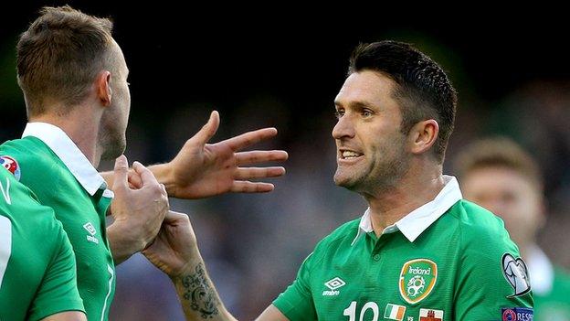 Robbie Keane celebrates with Aiden McGeady after scoring his first goal in the win over Gibraltar