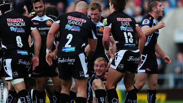 Damian Welch is helped up after scoring his first try against London Irish