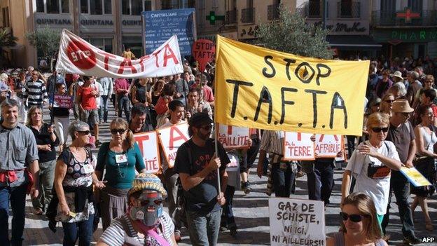 People protest against the Transatlantic Free Trade Agreement (TAFTA) in the southwestern French city of Narbonne on 11 October.