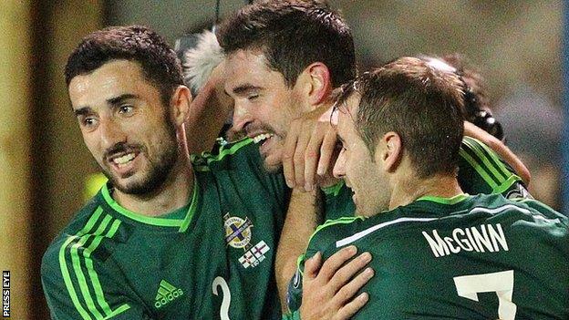 Northern Ireland players congratulate Kyle Lafferty on his 11th international goal