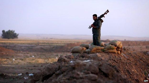 A Kurdish Peshmerga fighter on the front line