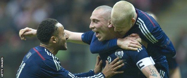 Scott Brown celebrates scoring the winner against Poland in Warsaw in March