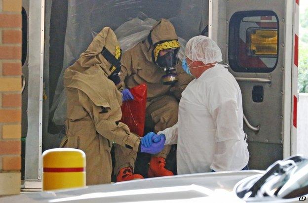 Staff in protective suits at Texas Health Presbyterian Hospital, Dallas, 8 October