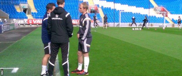 Jonathan Williams (R) pictured in Wales training on Sunday with heavy strapping on his left leg