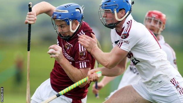 Cushendall's Paddy McGill and Slaughtneil's Se McGuigan