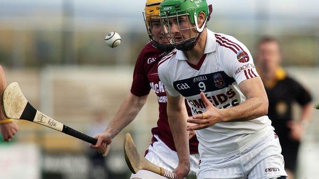 Slaughtneil's Chrissy McKaigue tries to solo away from Aidan McNaughton at Owenbeg