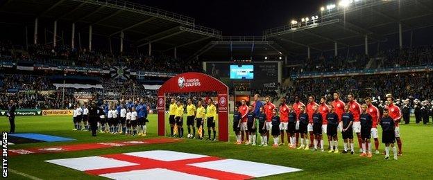 England and Estonia line up for the national anthems