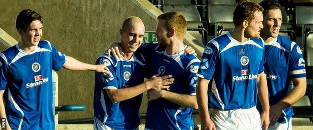 Stranraer's Jamie Longworth (second left) is congratulated on opening the scoring with a minute to go in the first half