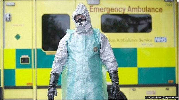 A paramedic in a protective suit