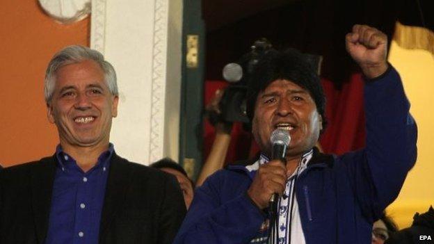 Bolivian president Evo Morales (right) and his vice-president Alvaro Garcia Linera (left) celebrate at the Government Palace in La Paz on 12 October 2014