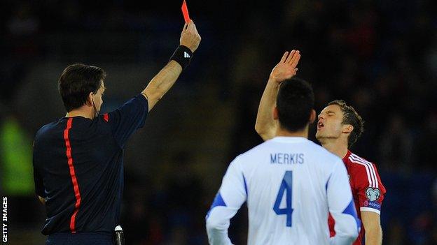 Andy King is shown the red card against Cyprus