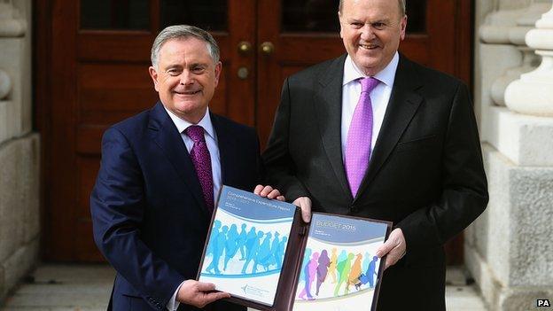 IMinister for Public Expenditure and Reform Brendan Howlin (left) and Minister for Finance Michael Noonan revealed a series of tax cuts and public spending announcements