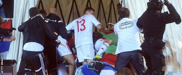 Albania's players run for cover during the Euro 2016 qualifier